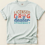 Light blue t-shirt with "LICENSED DRUG DEALER #PHARMACY" text.