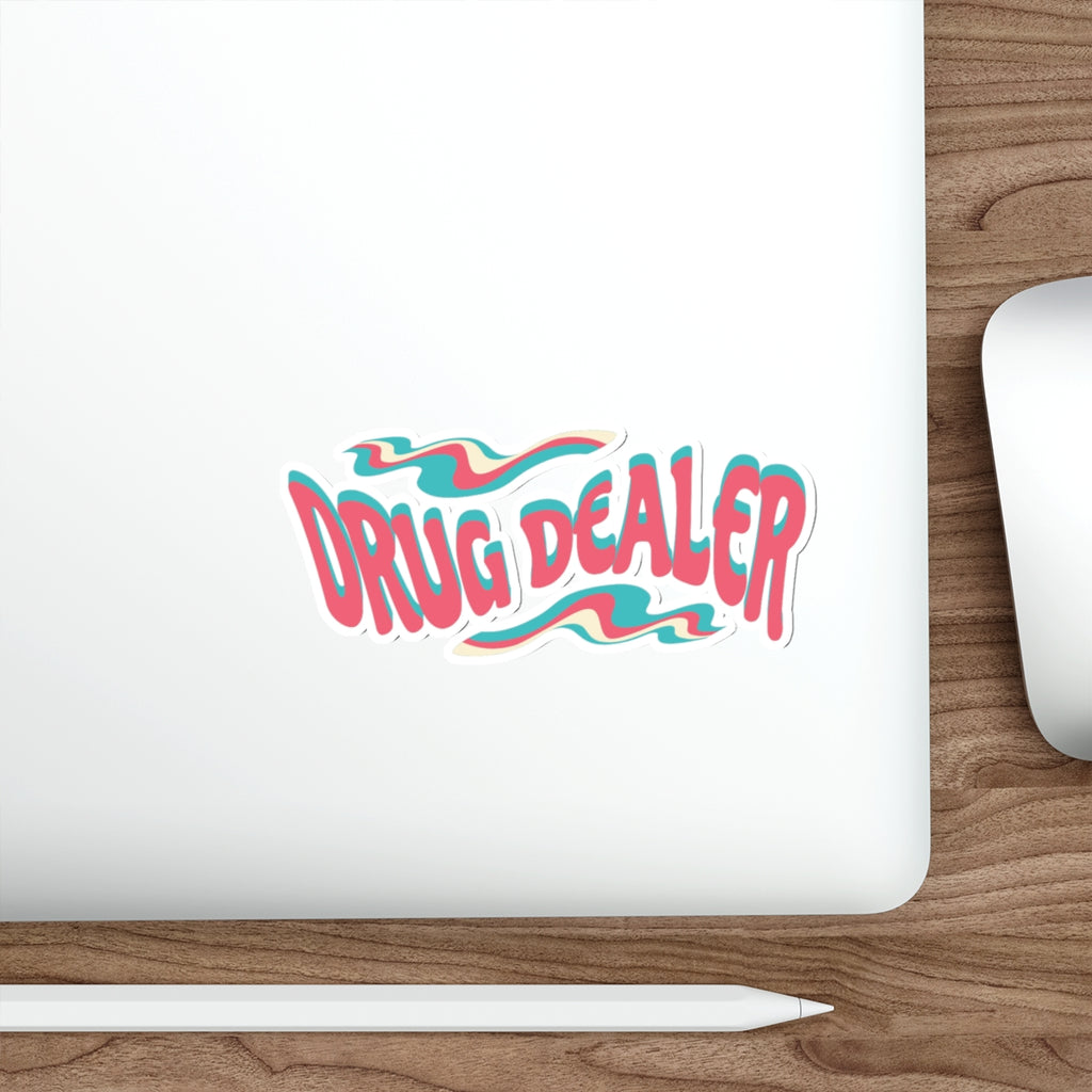 "Drug Dealer" text logo with wavy pink, blue, and white design on laptop.
