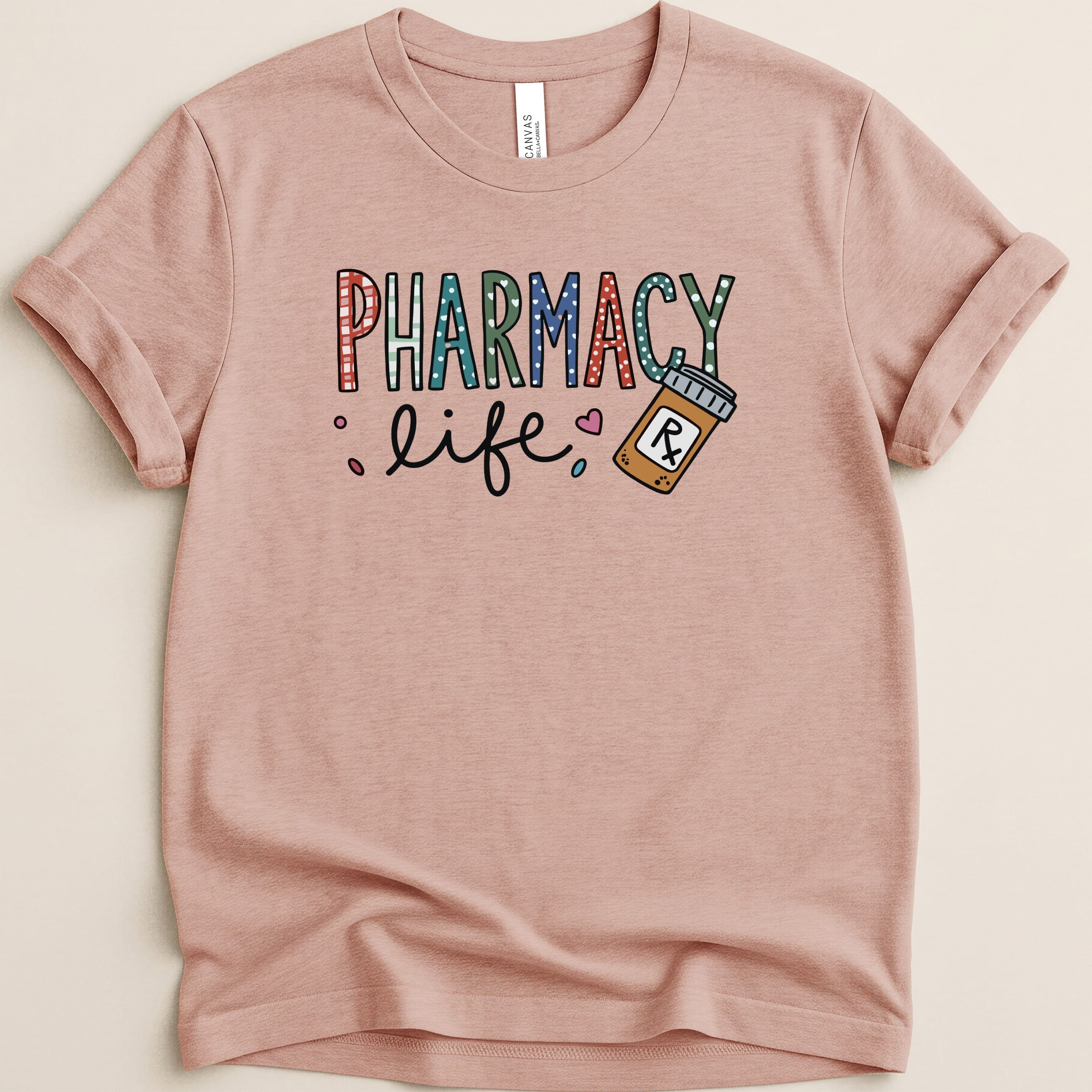 Pink t-shirt with "Pharmacy Life" text and a pill bottle illustration.