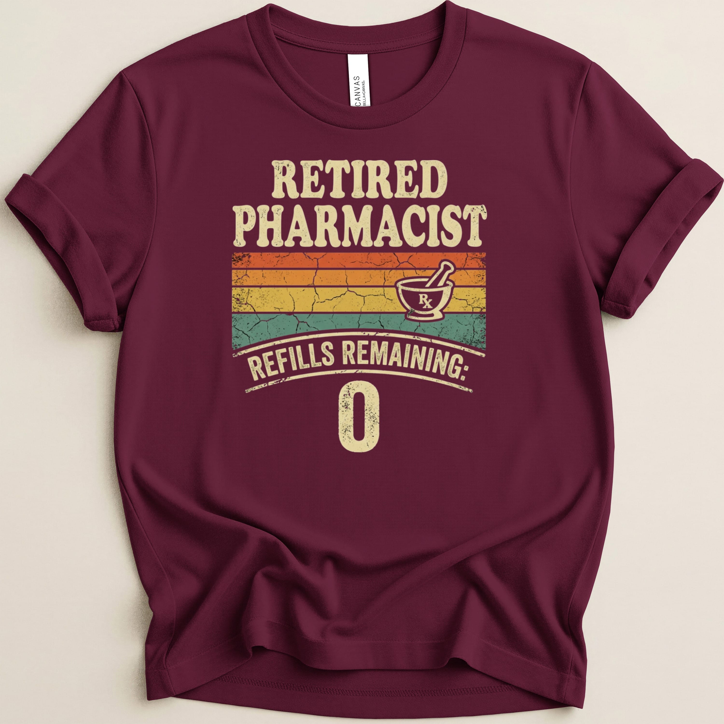 Maroon t-shirt with "Retired Pharmacist Refills Remaining: 0" text.