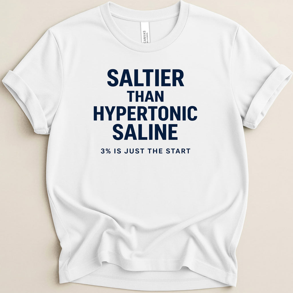 White t-shirt with navy text reading "SALTIER THAN HYPERTONIC SALINE 3% IS JUST THE START".