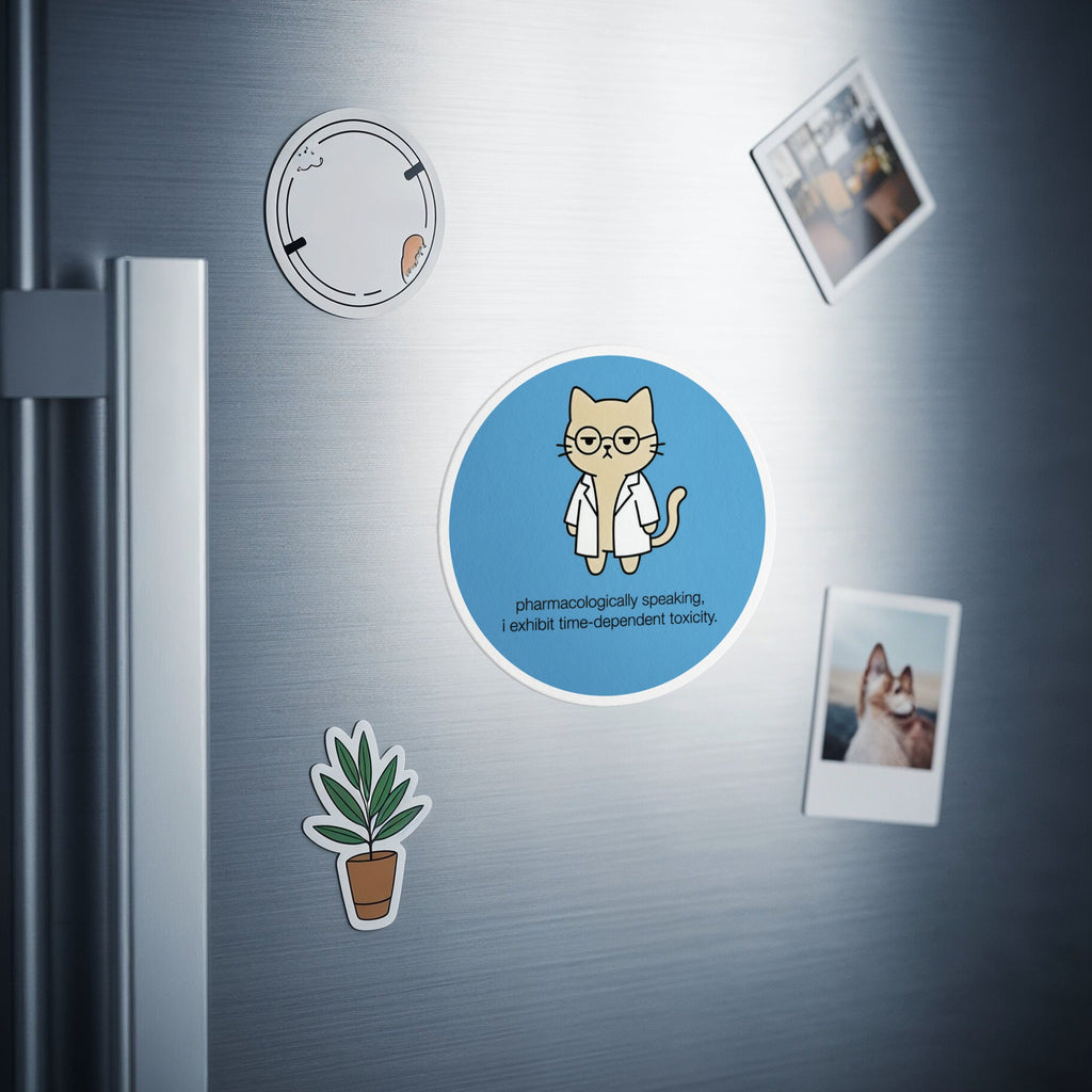 Circular magnet with a cat in glasses, text reads: pharmacologically speaking, I exhibit time-dependent toxicity.