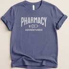 Navy t-shirt with "Pharmacy Adventures" logo in distressed white text.