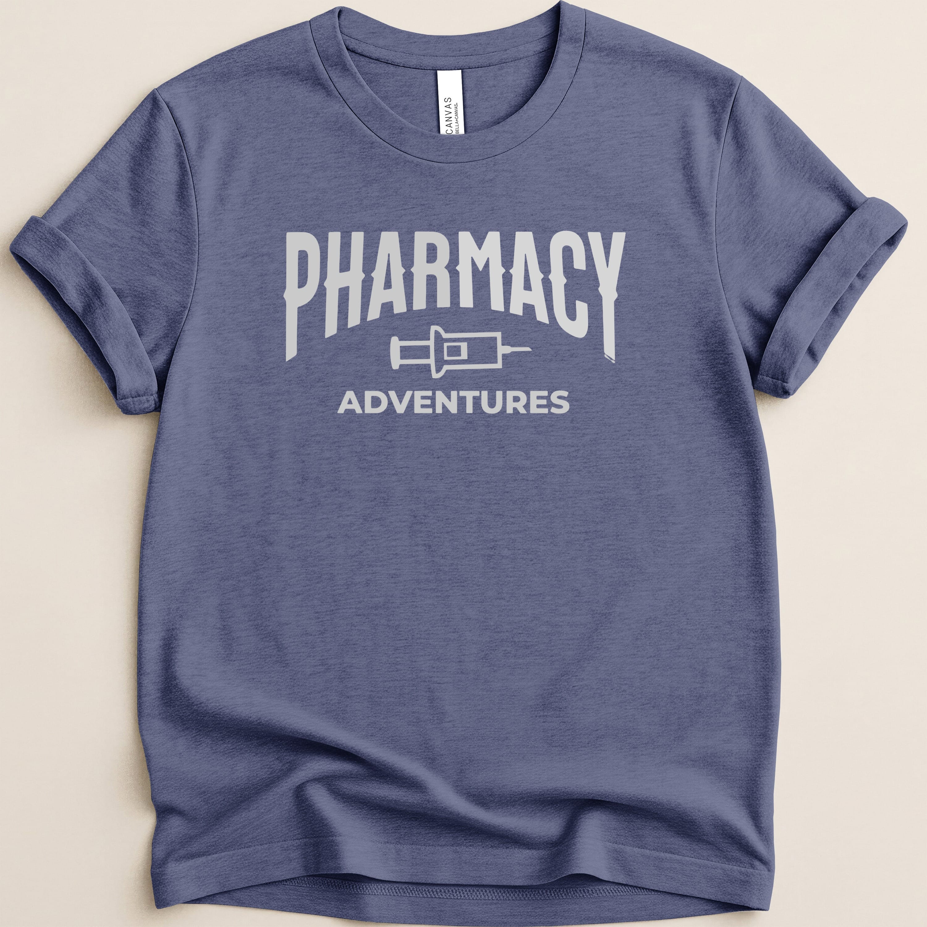 Navy t-shirt with "Pharmacy Adventures" logo in distressed white text.