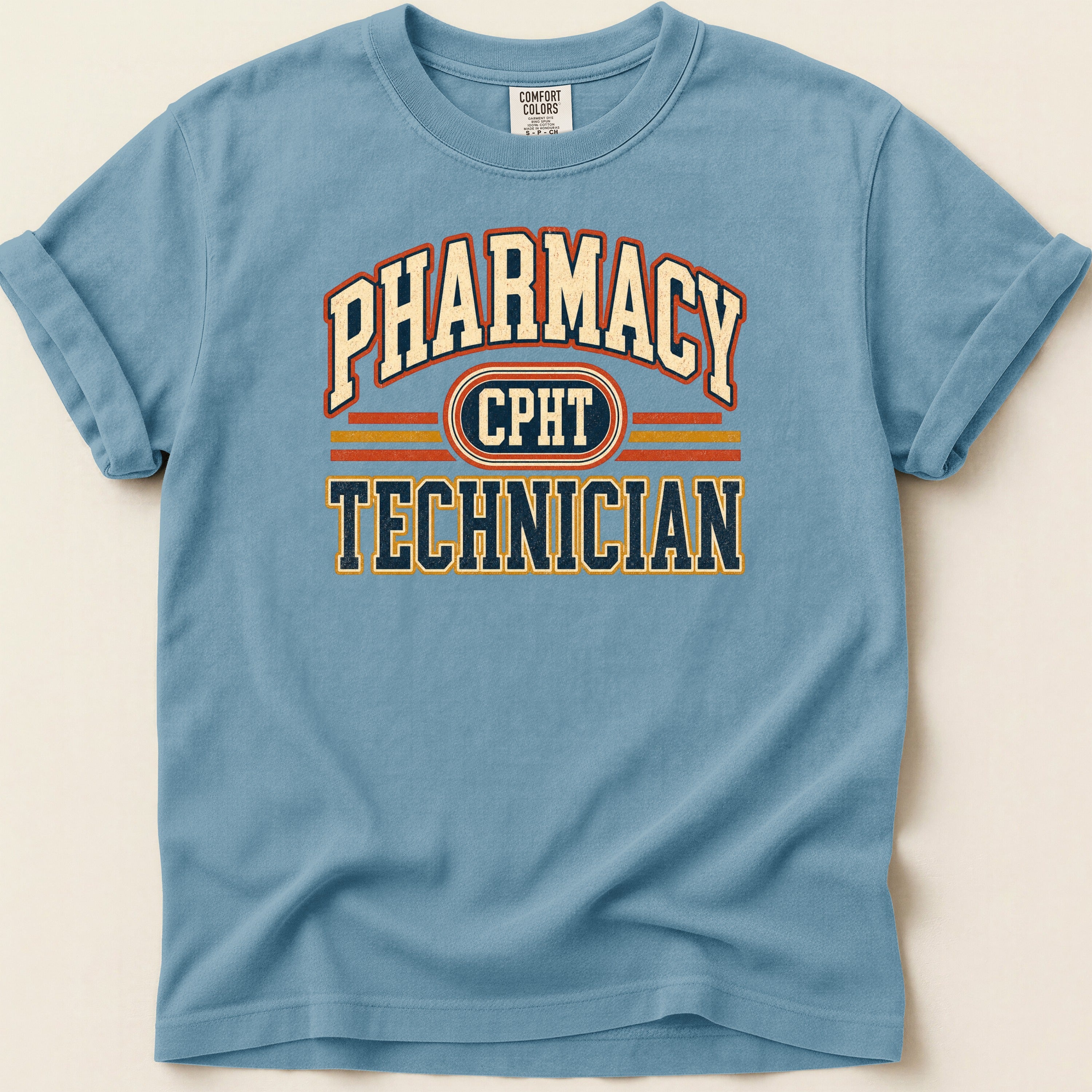 Blue t-shirt with "PHARMACY CPHT TECHNICIAN" text in a collegiate style.
