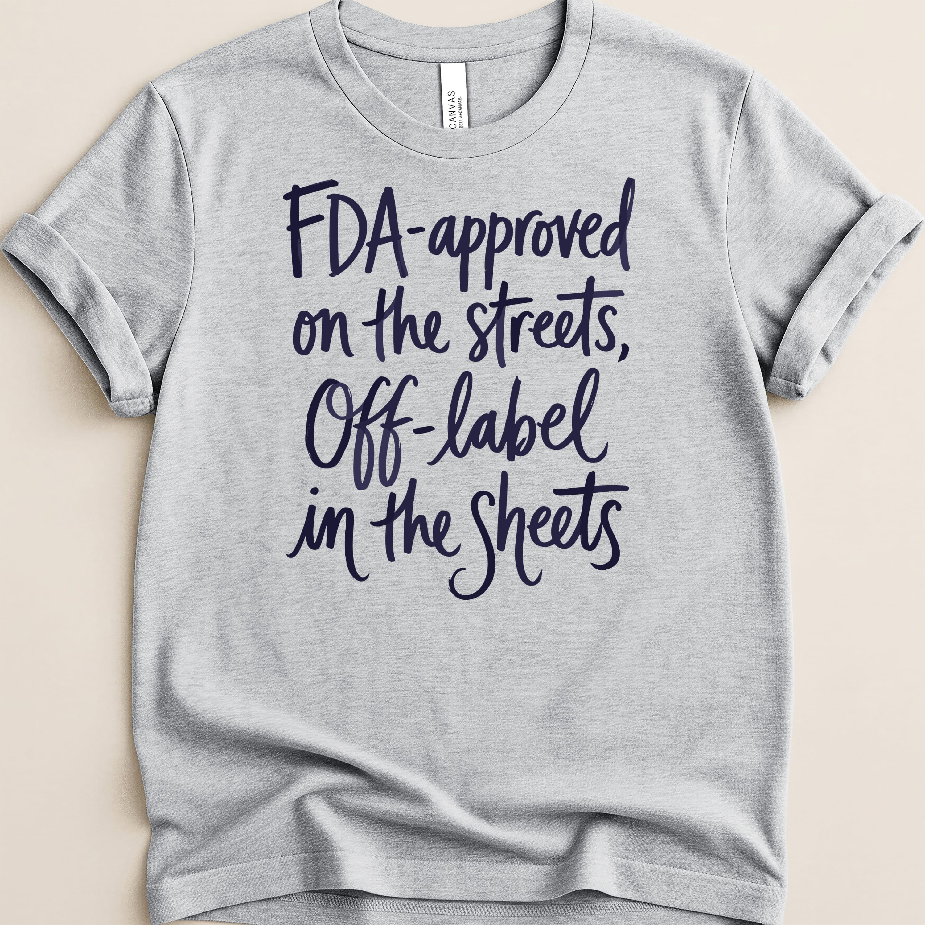 Gray t-shirt with dark blue text: "FDA-approved on the streets, Off-label in the Sheets."