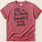 Red Comfort Colors t-shirt with "OTC on the streets, Schedule II in the sheets" text.