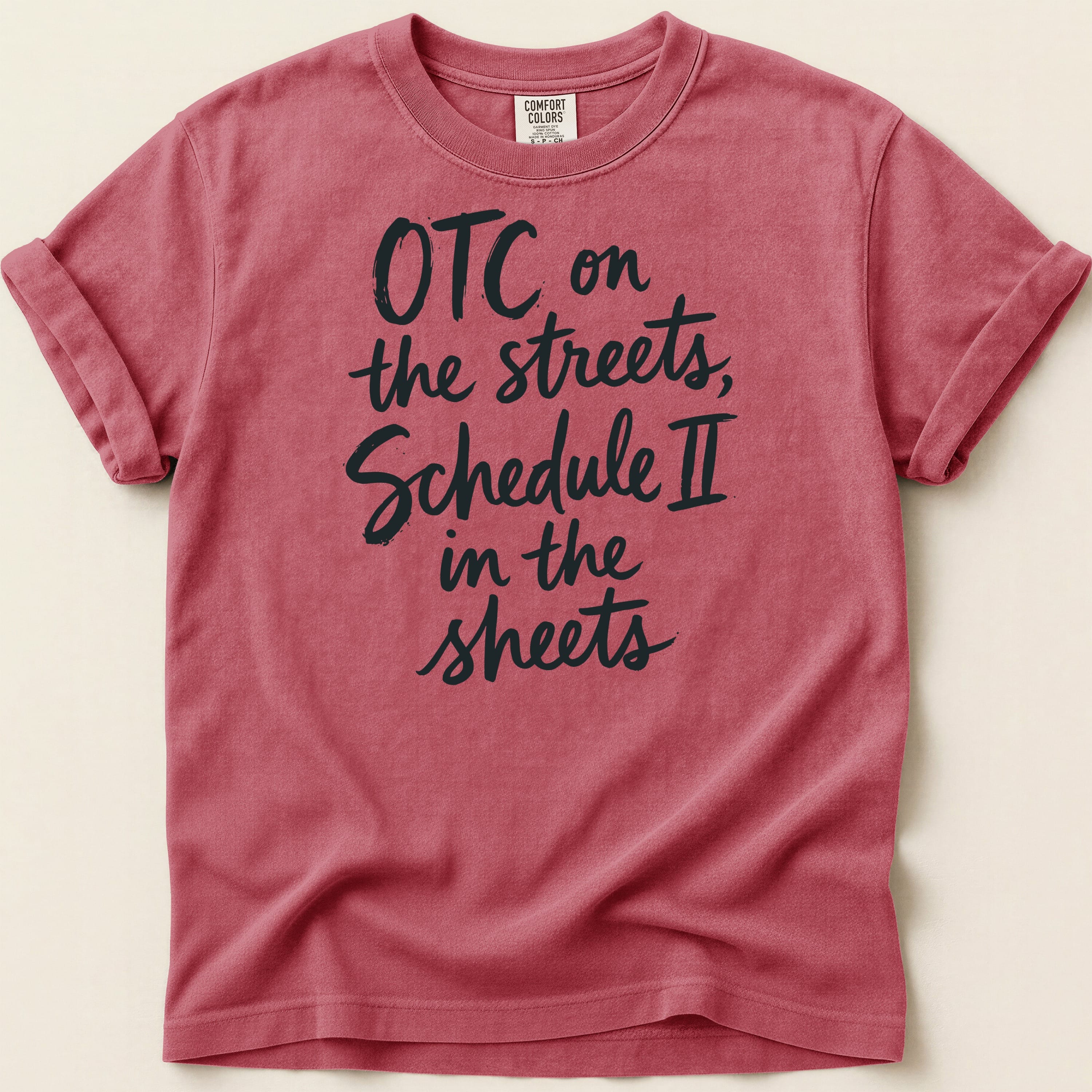 Red Comfort Colors t-shirt with "OTC on the streets, Schedule II in the sheets" text.