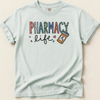 Light blue t-shirt with "Pharmacy Life" text and a pill bottle illustration.