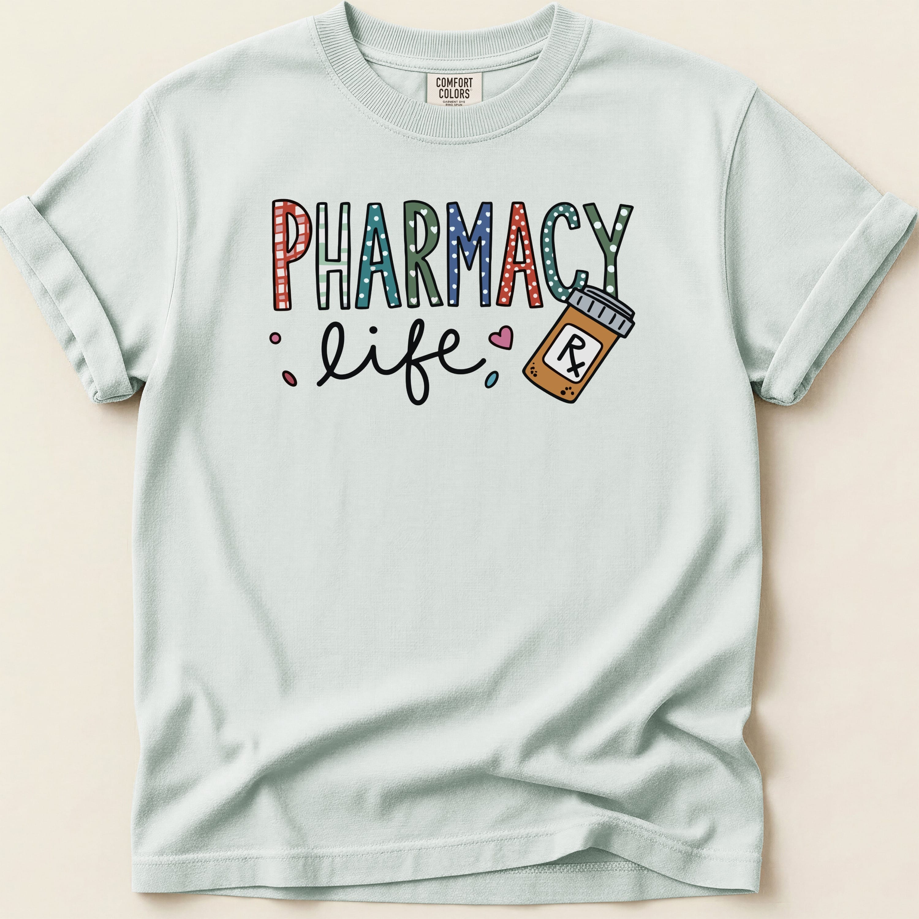 Light blue t-shirt with "Pharmacy Life" text and a pill bottle illustration.