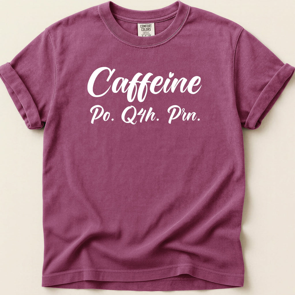 Washed maroon t-shirt with "Caffeine Po. Q4h. Prn." text.