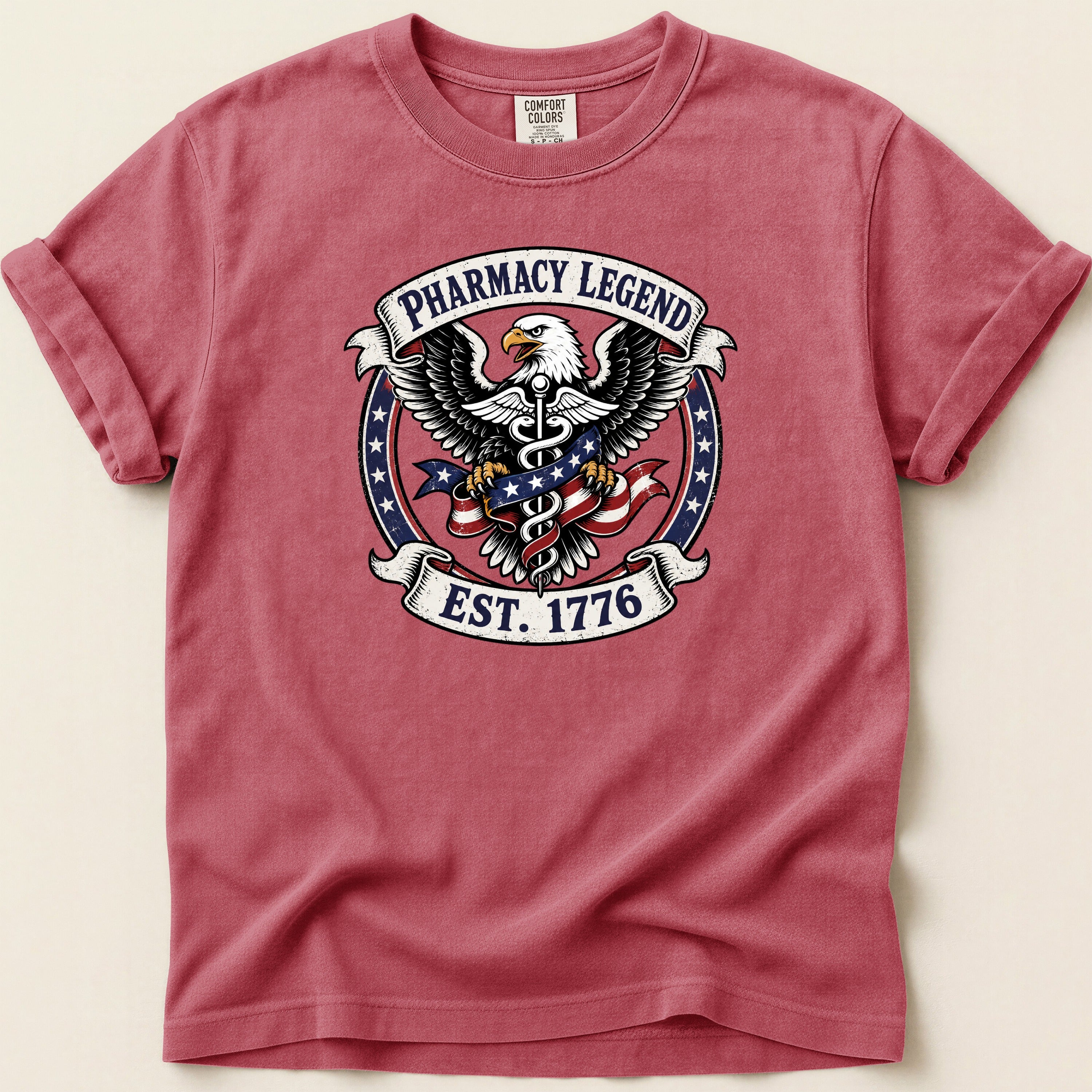 Red t-shirt with Pharmacy Legend EST. 1776 eagle emblem.