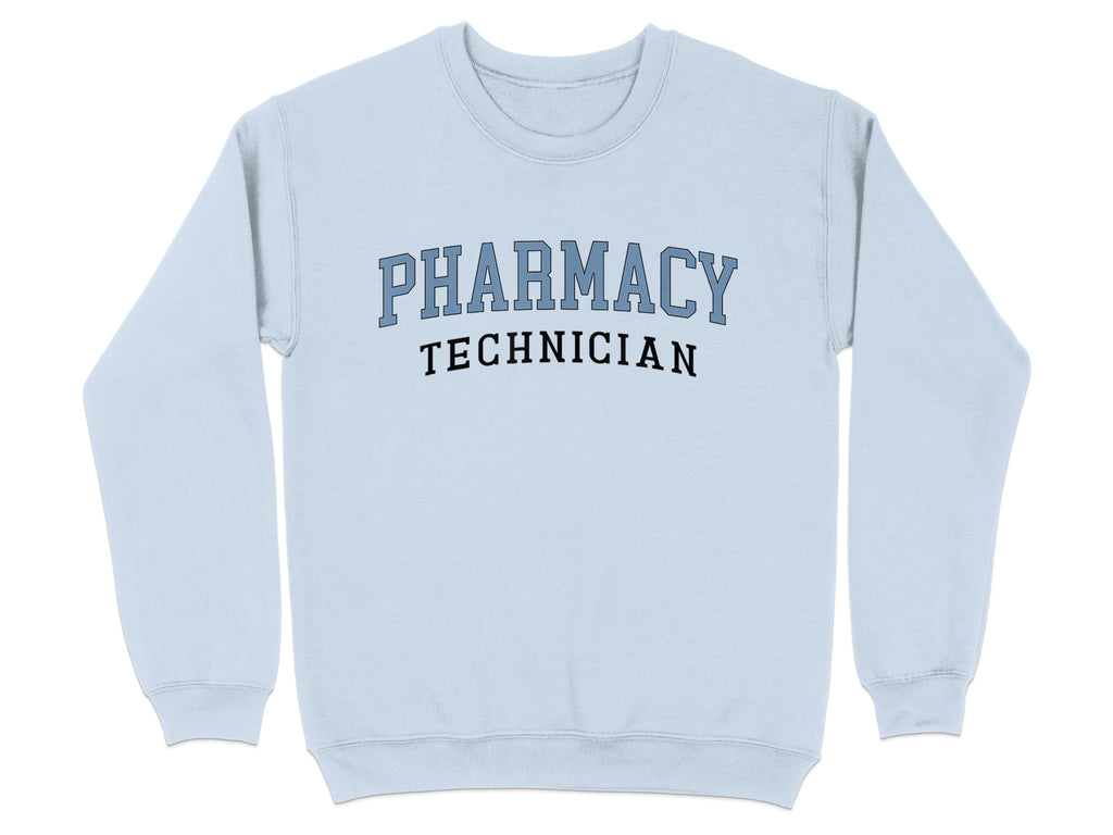 Light blue sweatshirt with "PHARMACY TECHNICIAN" in blue collegiate lettering.