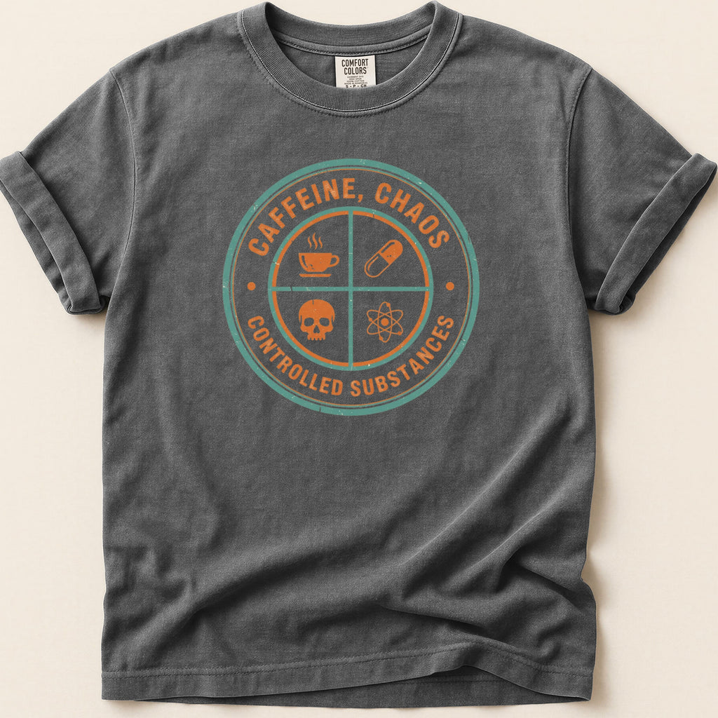 Dark grey t-shirt with circular "CAFFEINE, CHAOS CONTROLLED SUBSTANCES" graphic.