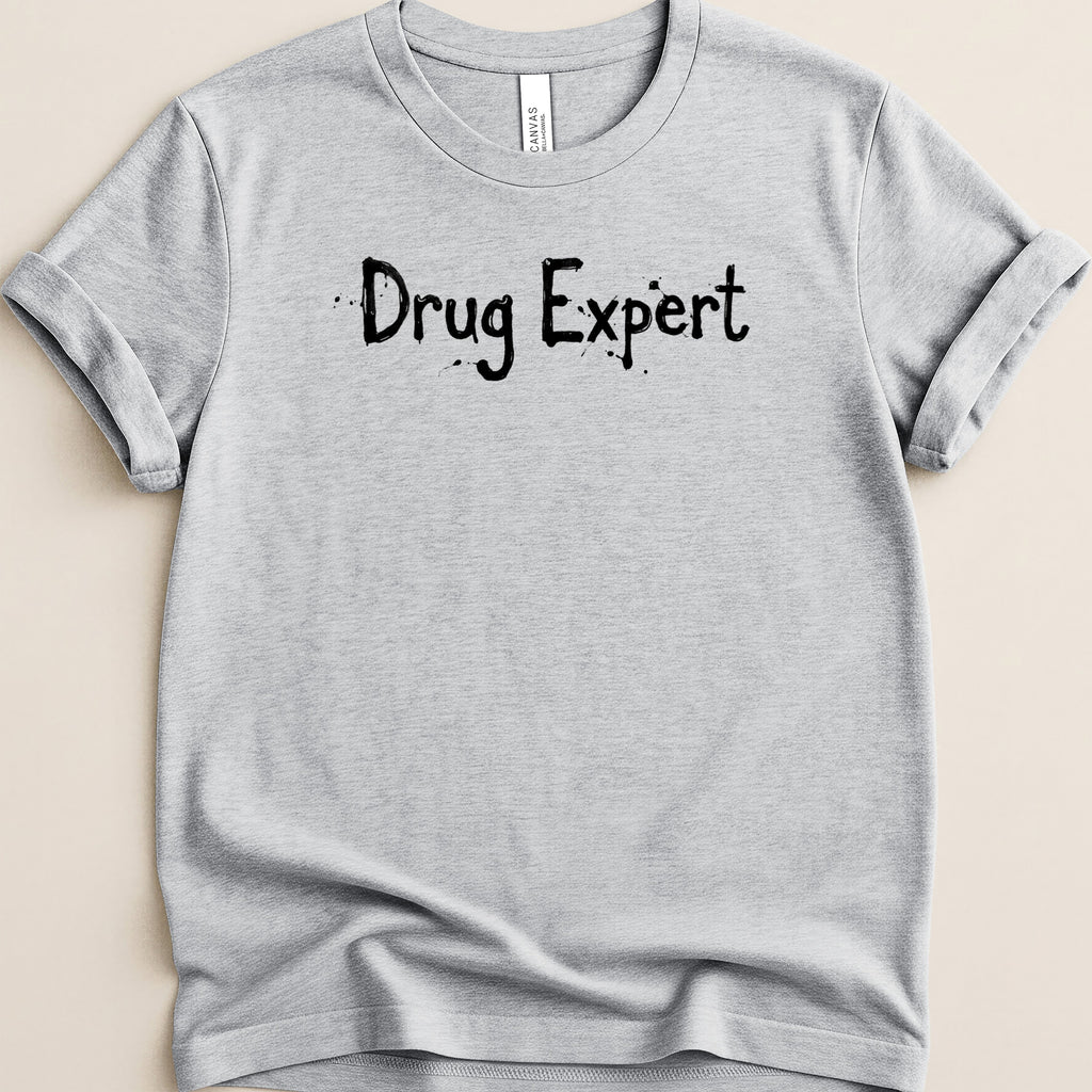 Gray t-shirt with black text "Drug Expert" printed on it.