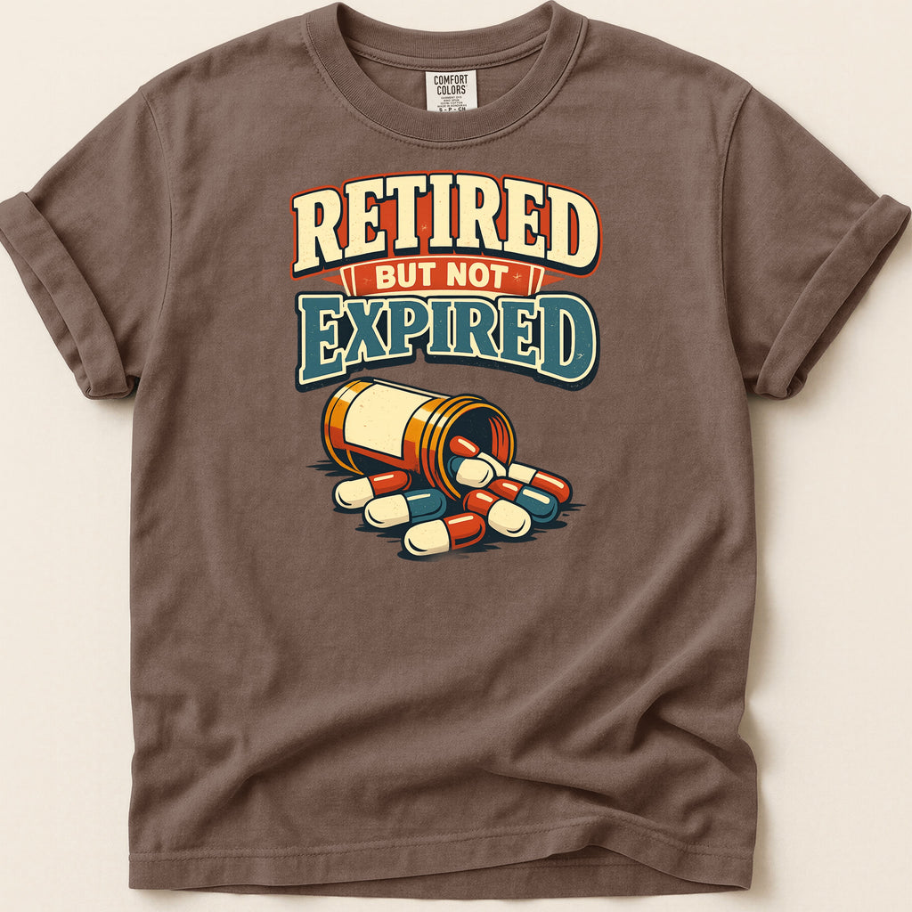 T-shirt with "Retired but not expired" text and a pill bottle.