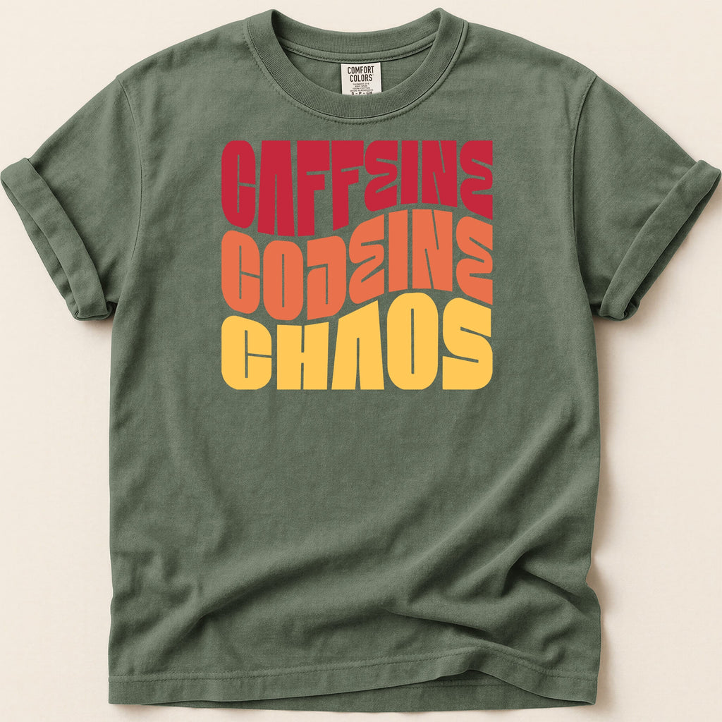 Green t-shirt with "CAFFEINE CODEINE CHAOS" in bold, colorful retro lettering.