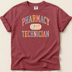 Burgundy t-shirt with "Pharmacy Technician CPHT" text in colorful distressed lettering.