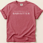 Red Comfort Colors t-shirt with "PHARMACIST BABYSITTER" printed in white.