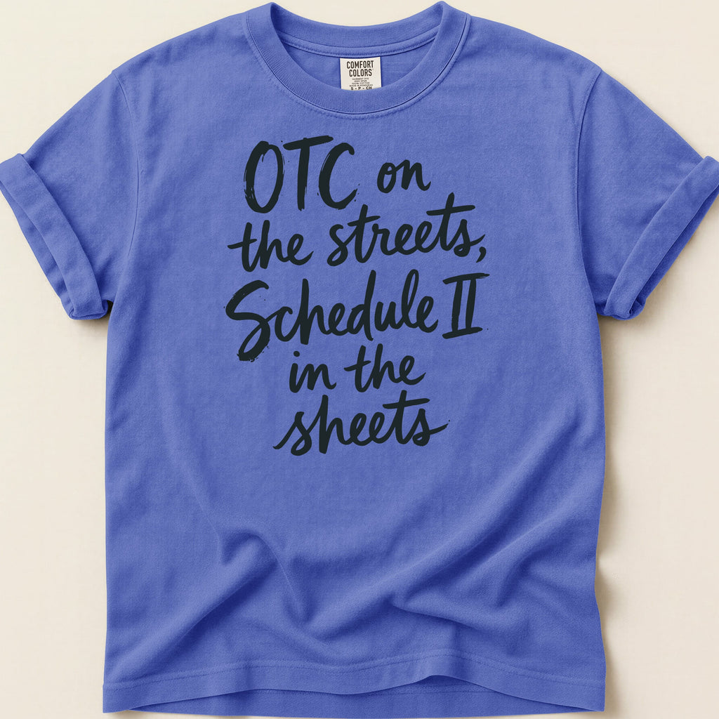 Purple t-shirt with "OTC on the streets, Schedule II in the sheets" in black script.