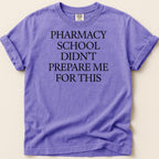 Purple t-shirt with "Pharmacy school didn't prepare me for this" text.