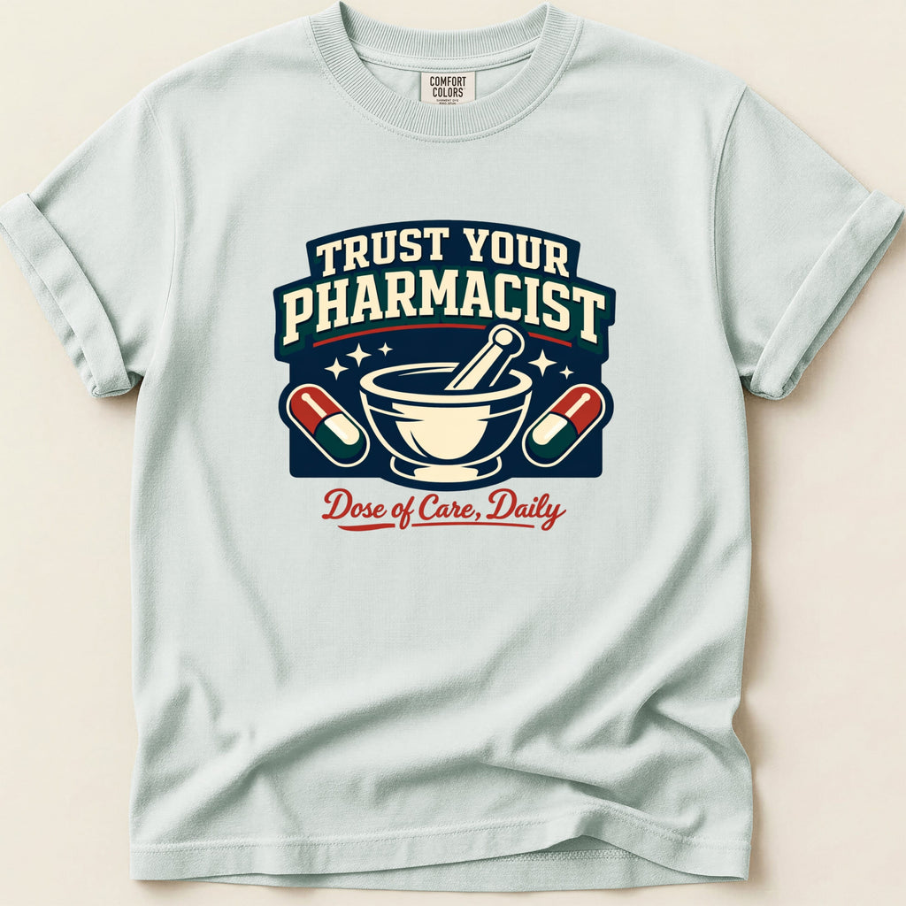 Light blue t-shirt with "Trust Your Pharmacist Dose of Care, Daily" graphic.