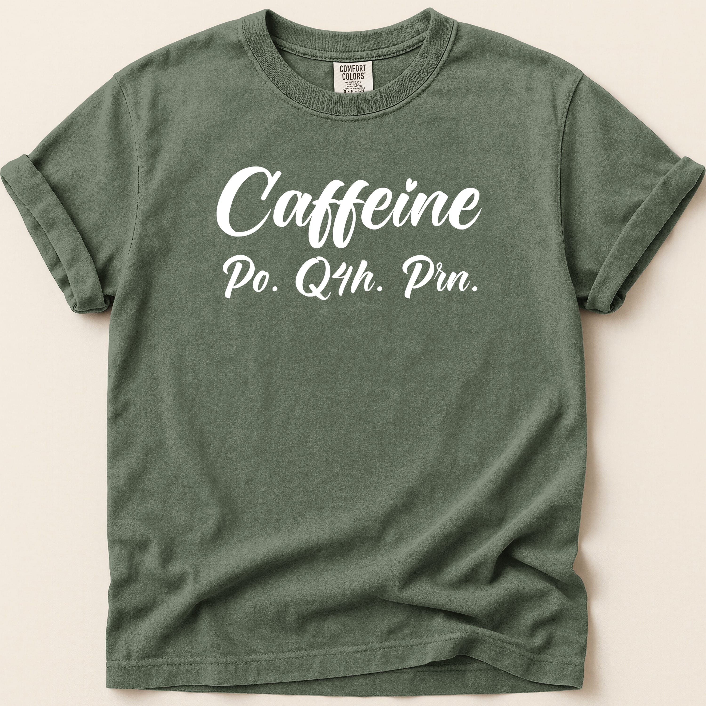 Green t-shirt with "Caffeine Po. Q4h. Prn." text.
