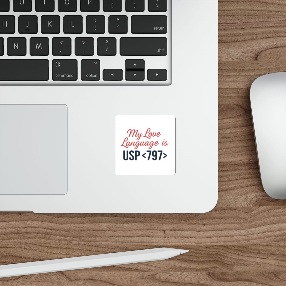 Square sticker on laptop keyboard reading "My Love Language is USP<797>".