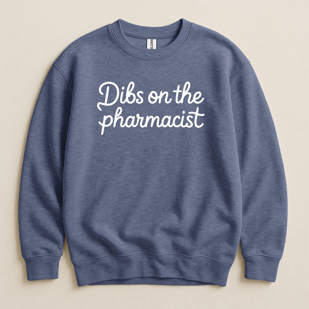 Blue Gildan sweatshirt with "Dibs on the pharmacist" text in white script.