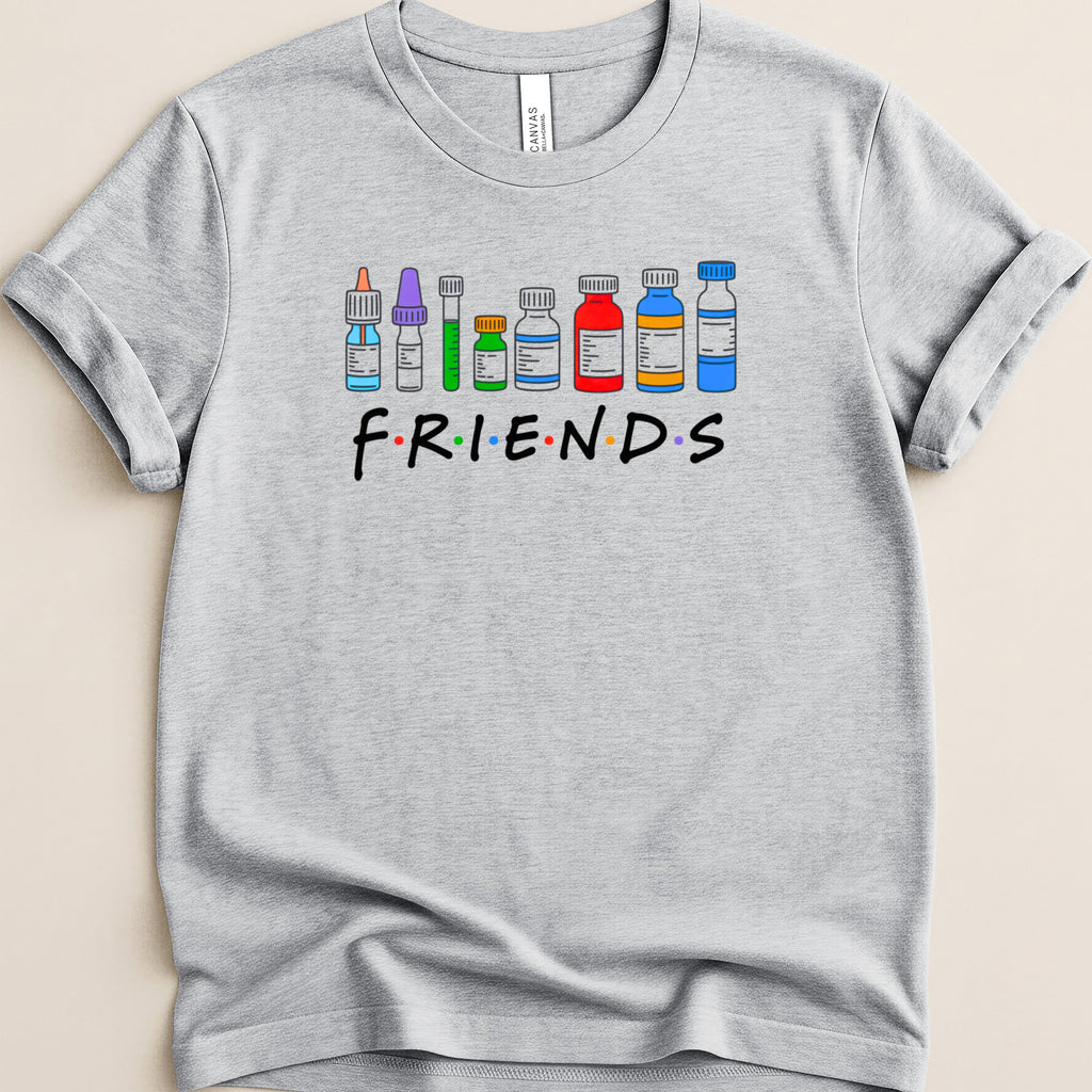 Grey t-shirt with "FRIENDS" text and cartoon medical vials.