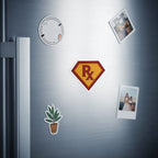 Super R-X symbol magnet and framed photos on a stainless steel refrigerator door.