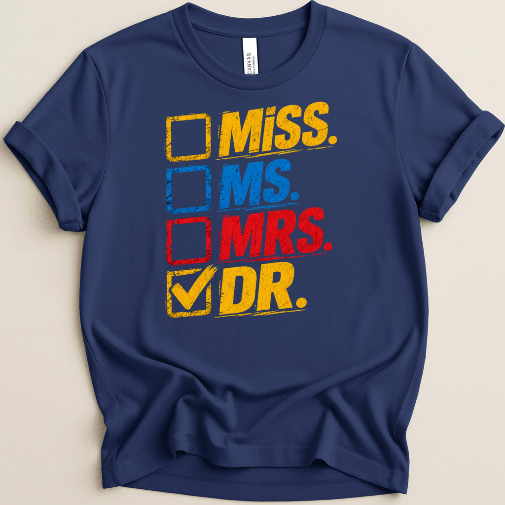 Navy t-shirt with distressed yellow, blue, and red text: Miss, Ms, Mrs, Dr.