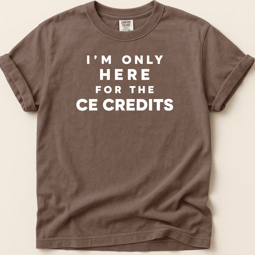 Brown t-shirt with white text "I'M ONLY HERE FOR THE CE CREDITS".