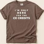 Brown t-shirt with white text "I'M ONLY HERE FOR THE CE CREDITS".