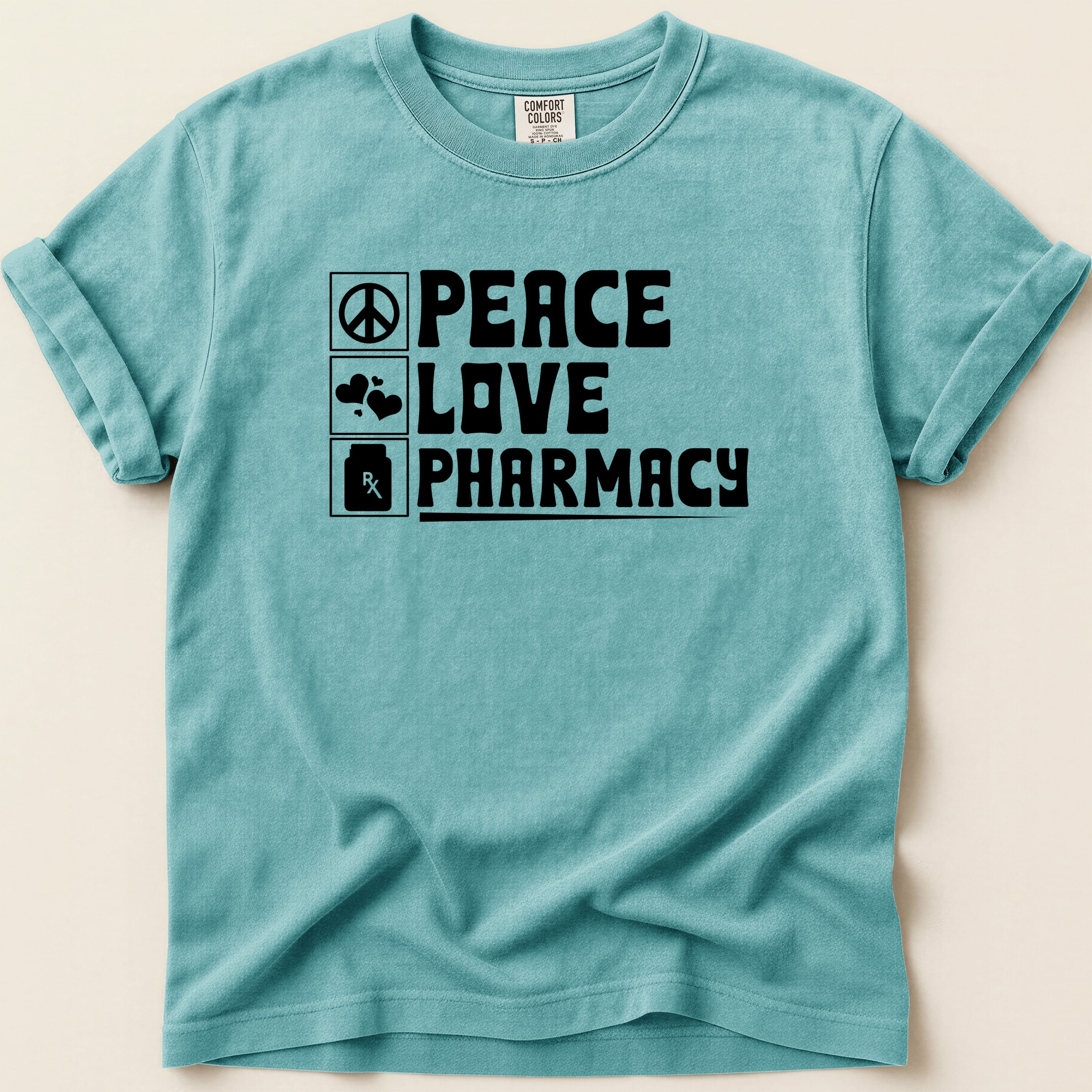 Teal t-shirt with black text "PEACE LOVE PHARMACY" and icons.