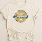 Cream t-shirt with "Totally Rad Pharmacist" text and pill graphic.