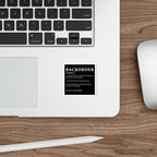 Sticker with dictionary definition of "BACKORDER" on a wooden surface.