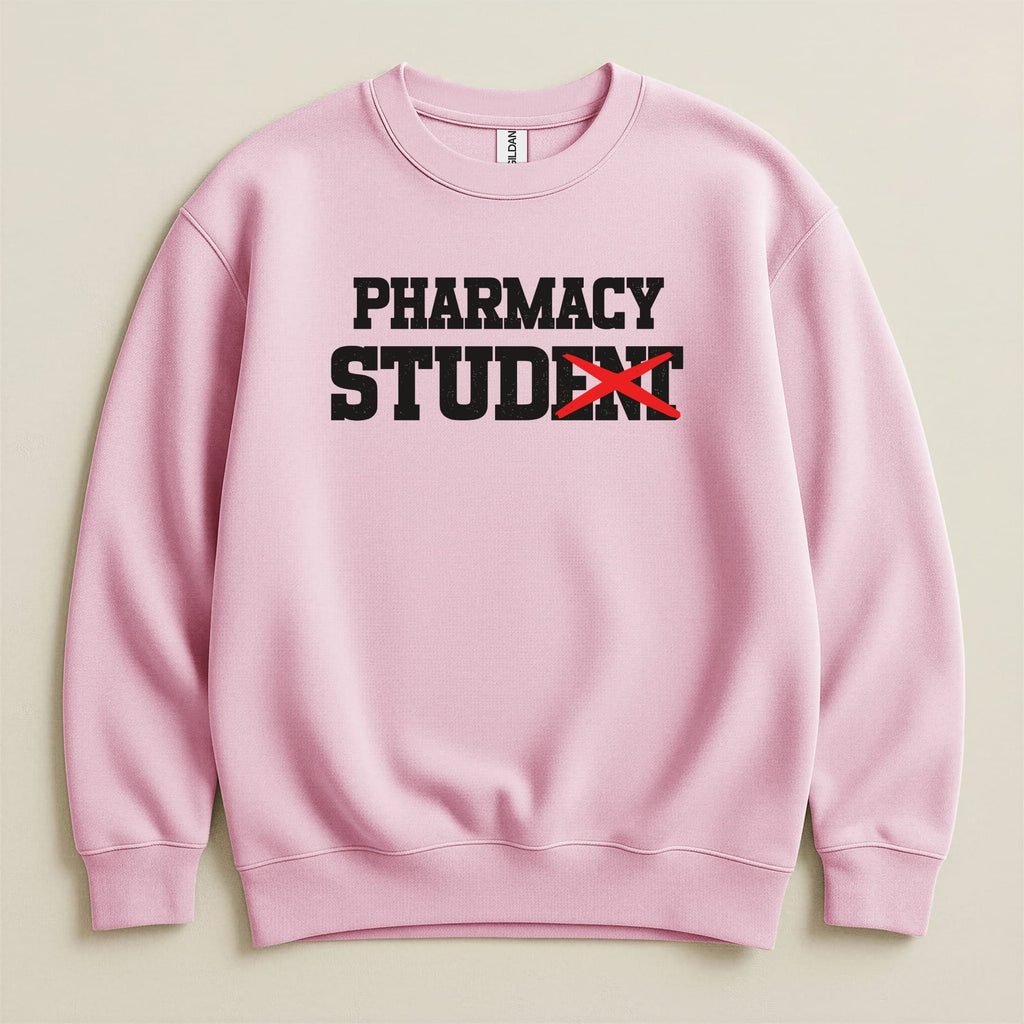 Light pink sweatshirt with "PHARMACY STUDENT" text, the "T" in student is crossed out.