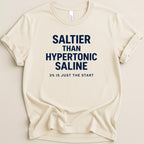 Cream t-shirt with navy text reading "SALTier THAN HYPERTONIC SALINE 3% IS JUST THE START".