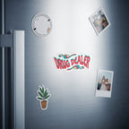 Sticker with "DRUG DEALER" text and graphic, plus two photos on refrigerator.