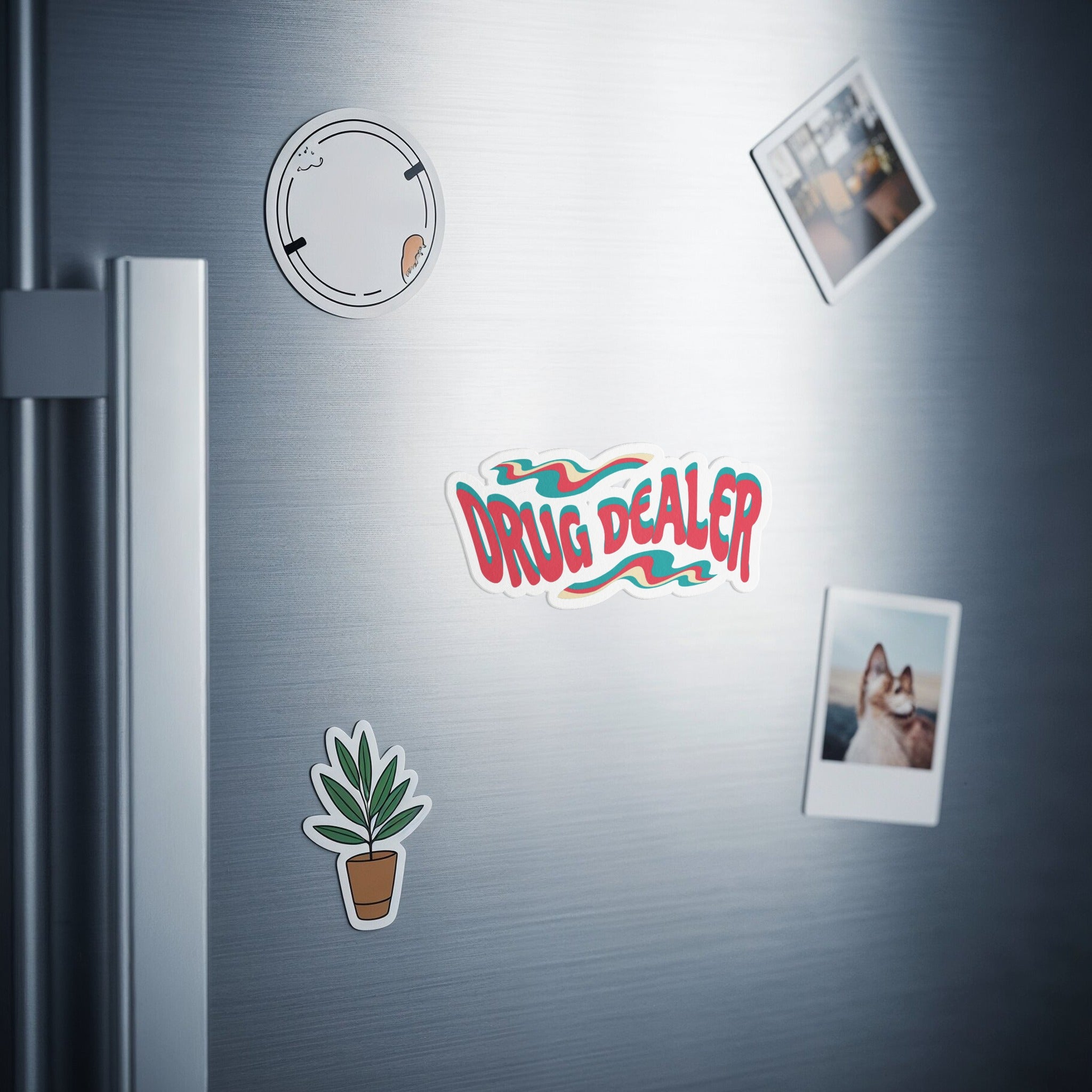 Sticker with "DRUG DEALER" text and graphic, plus two photos on refrigerator.