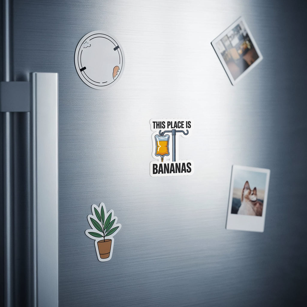Fridge magnets including a drip bag labeled "This Place is Bananas" and a potted plant.