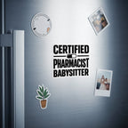 "Certified Pharmacist Babysitter" text on a sticker on a refrigerator door.