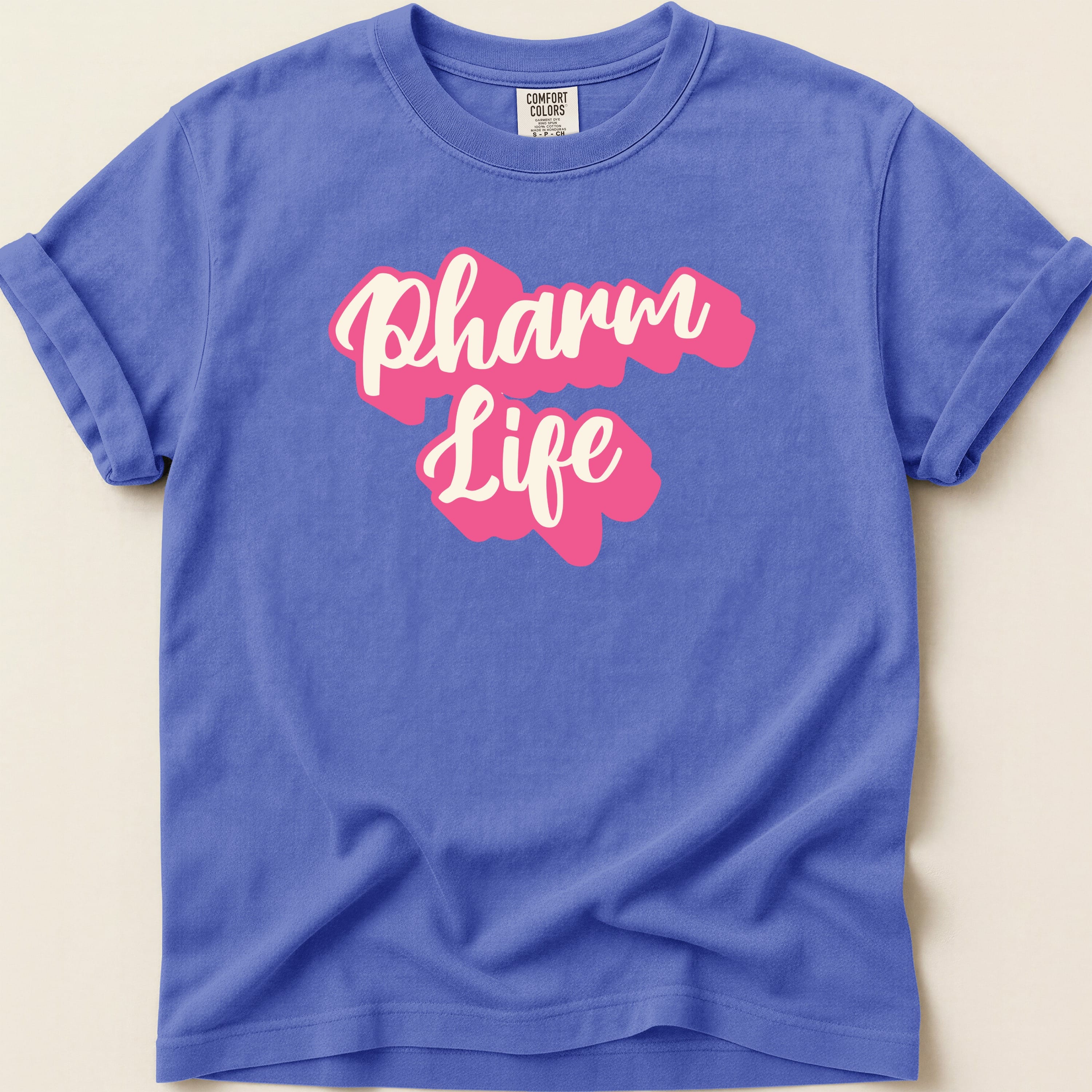Purple t-shirt with pink "Pharm Life" text.