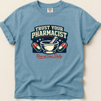 Blue t-shirt with "Trust Your Pharmacist" and mortar and pestle graphic.