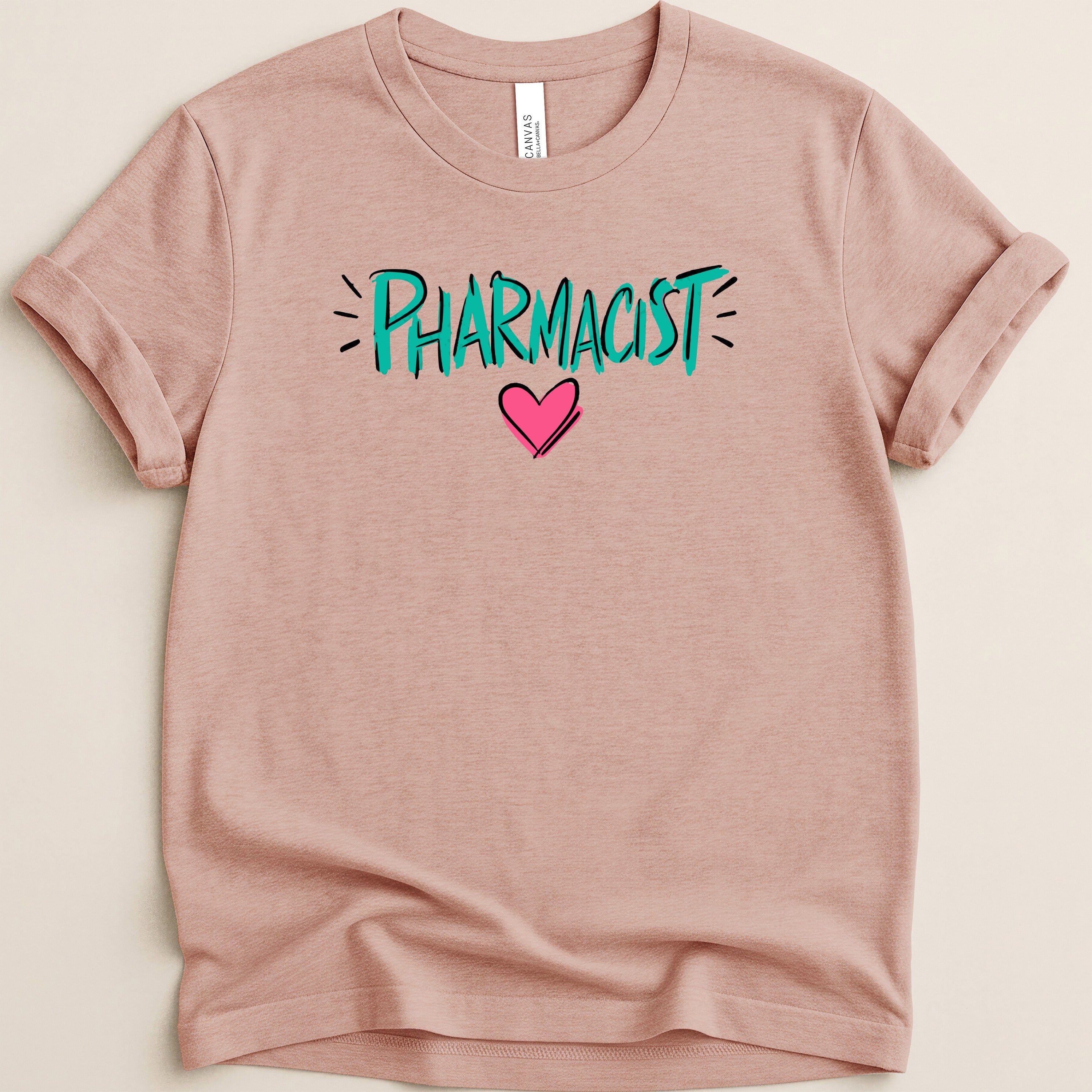 Pink t-shirt with "PHARMACIST" text and a pink heart graphic.