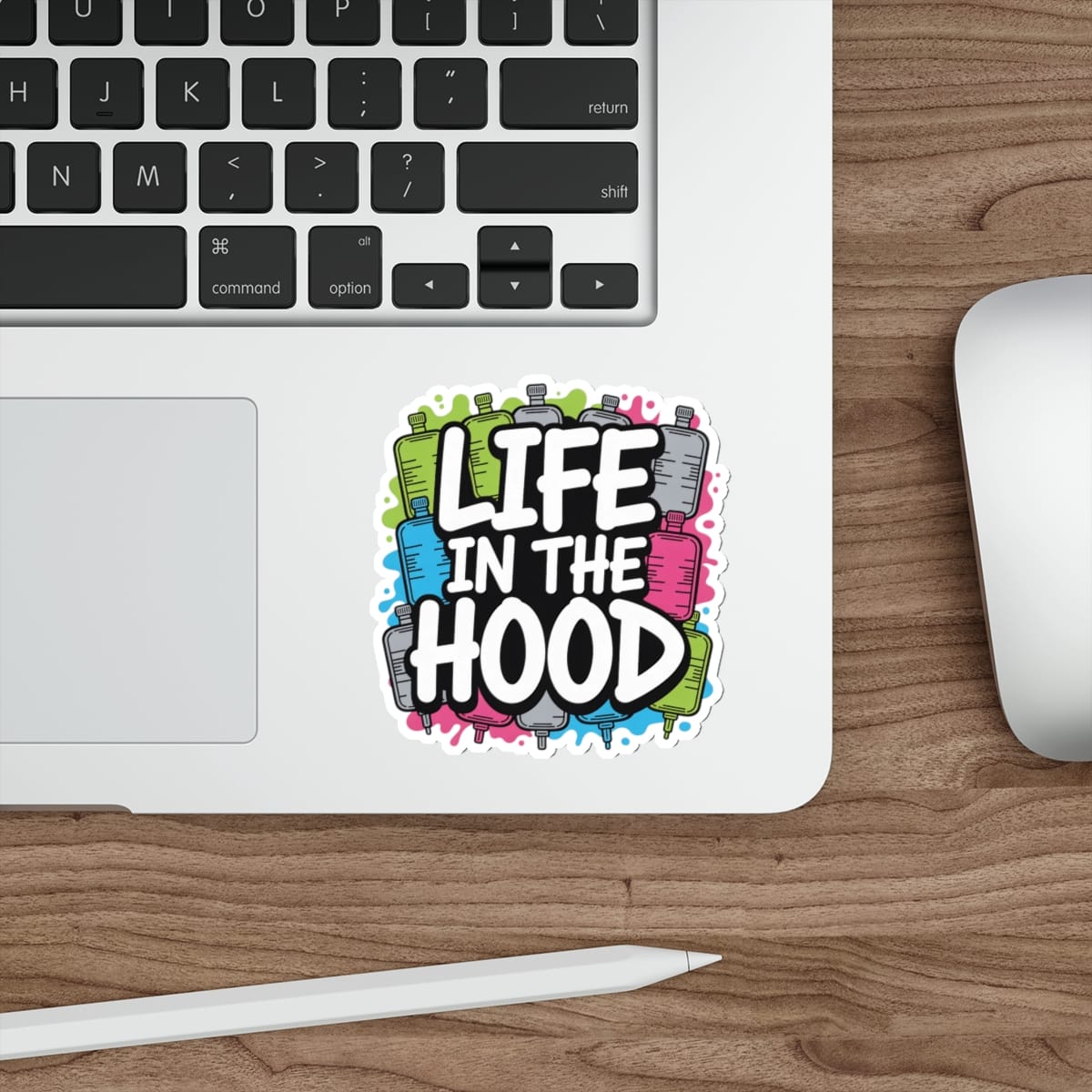 Sticker with "Life in the Hood" text and colorful graffiti cans.