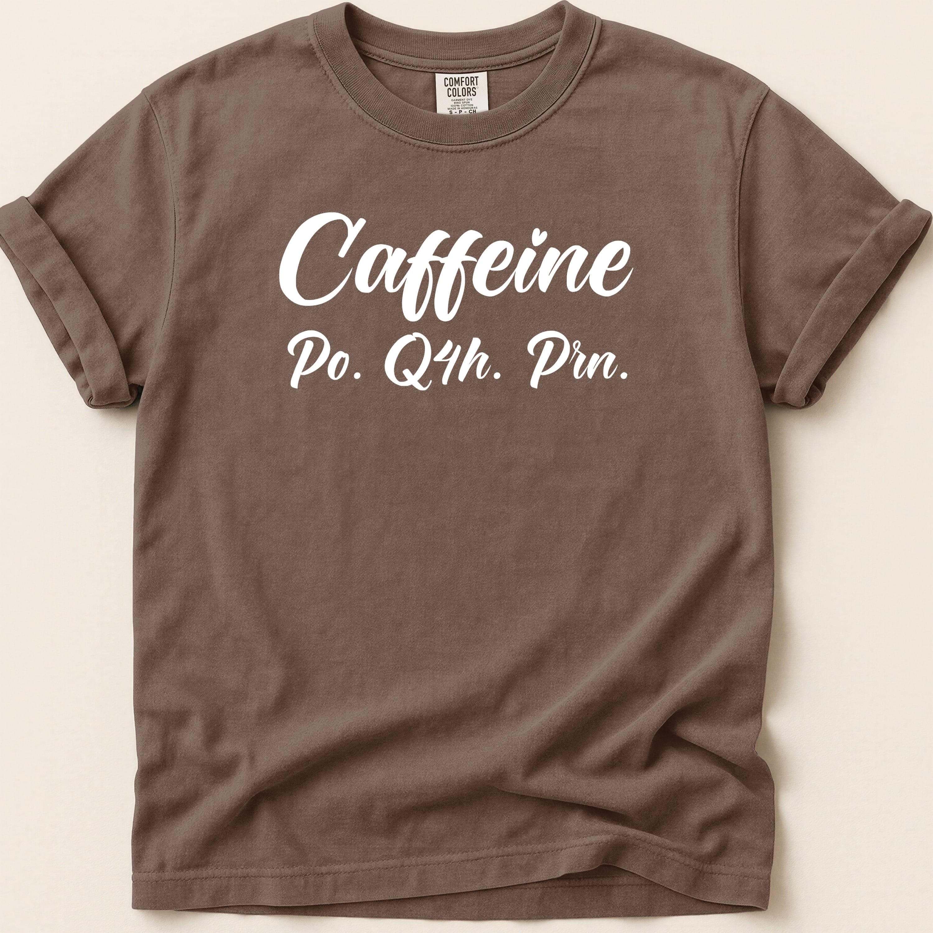 Brown t-shirt with "Caffeine Po. Q4h. Prn." text.