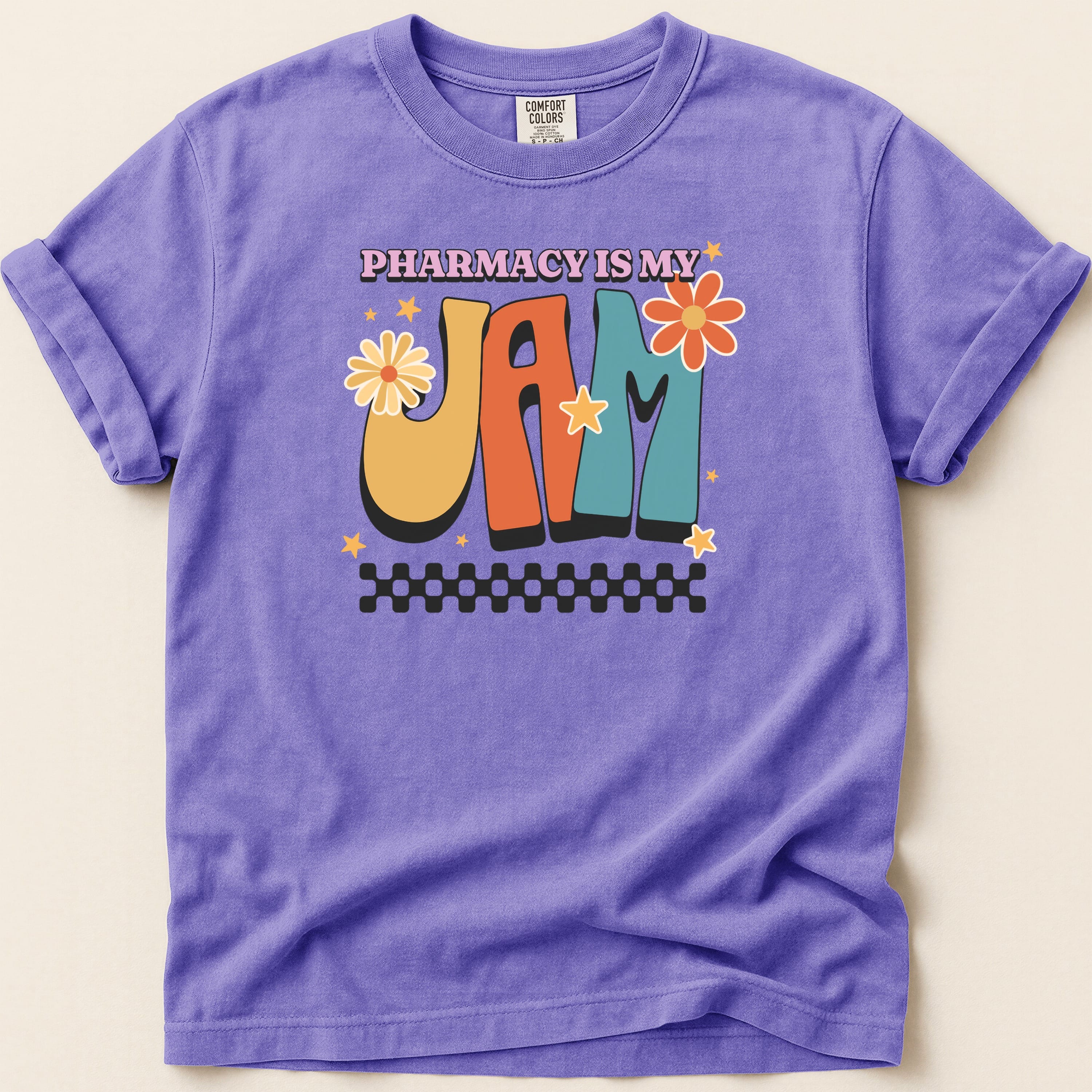 Purple t-shirt with "Pharmacy is My Jam" in retro, colorful lettering.