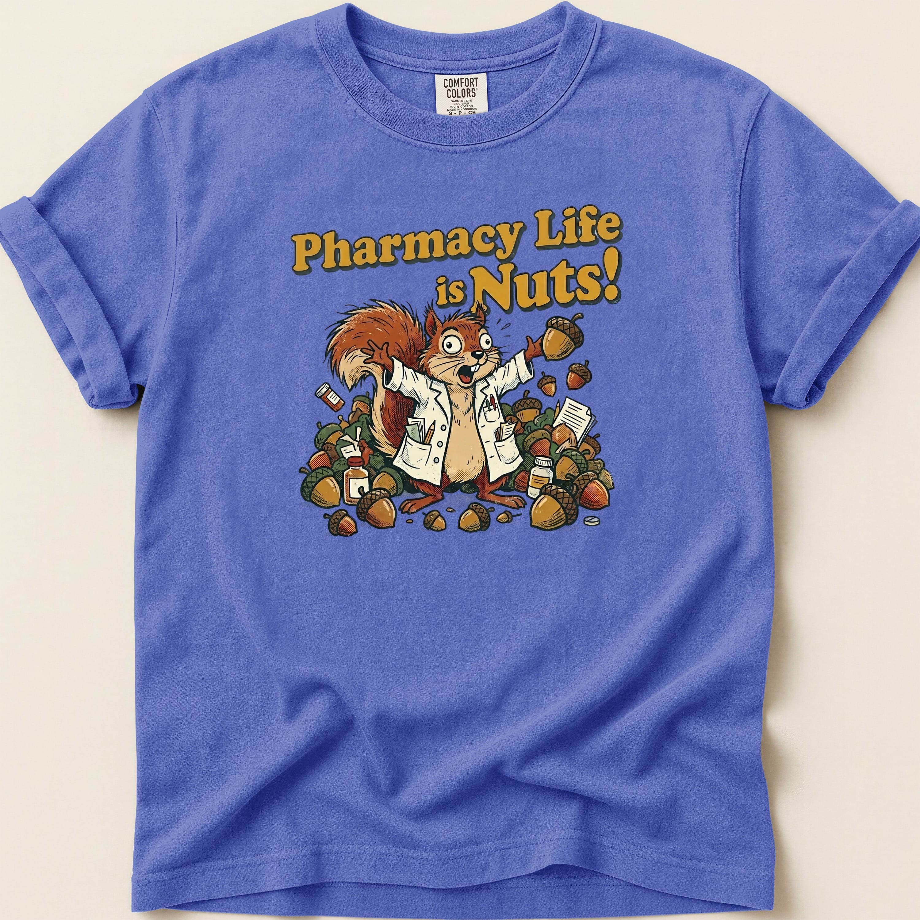 Squirrel in lab coat holding acorns with text "Pharmacy Life is Nuts!".